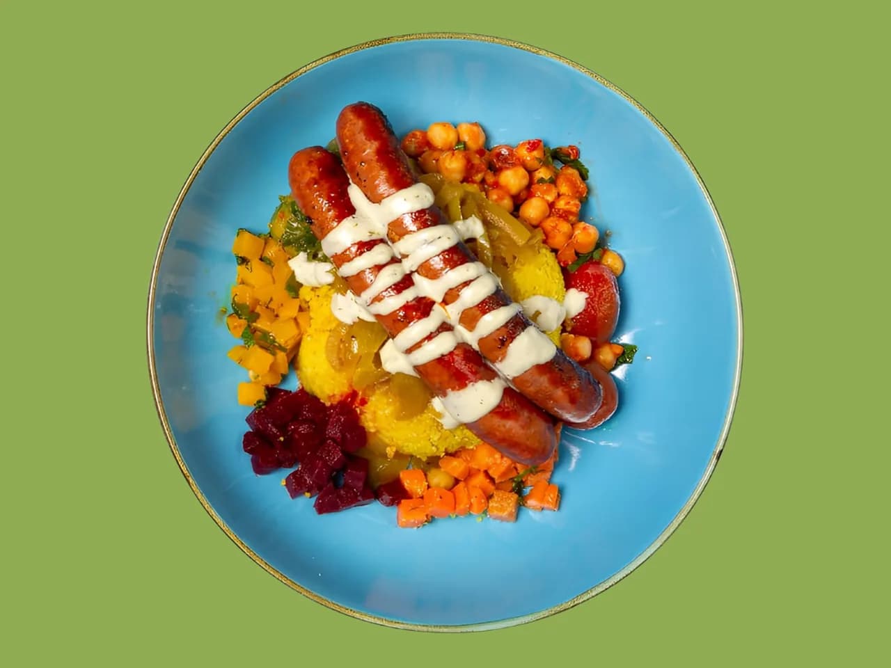 Sahara Soul Bowl von oben: Lamm-Merguez mit Kichererbsen und einer Schale Harissa daneben